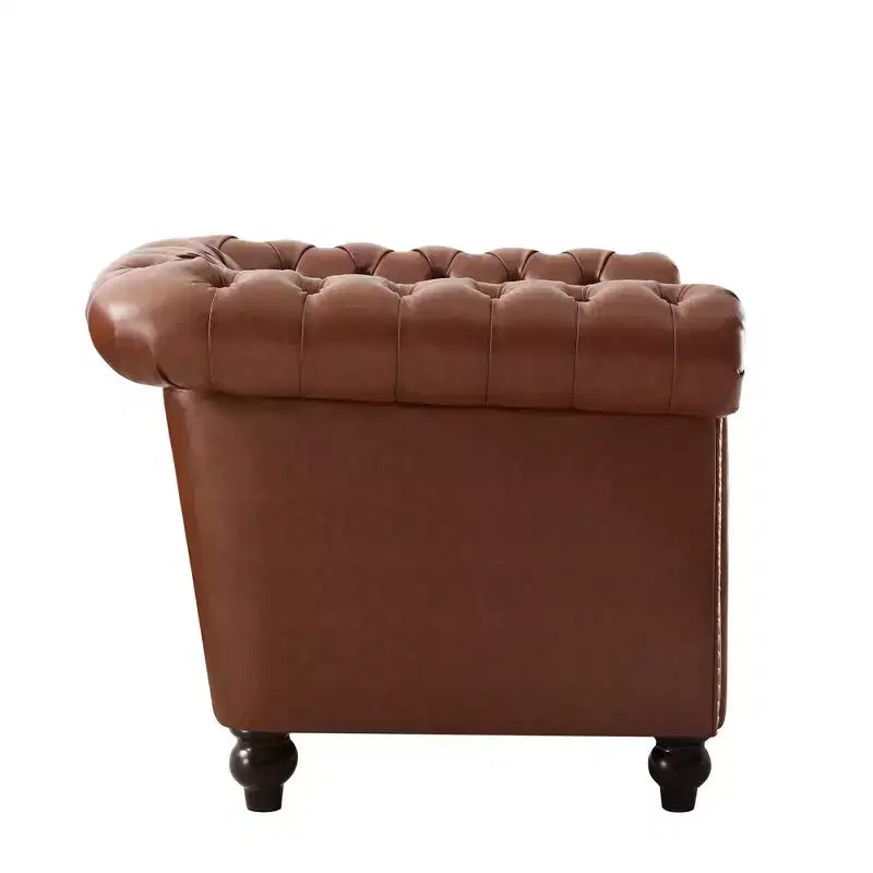 Fauteuil club Chesterfield avec accoudoirs arrondis, garniture cloutée et pieds en bois massif