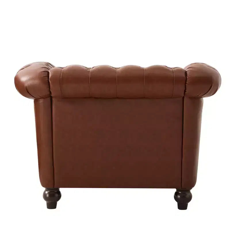 Fauteuil club Chesterfield avec accoudoirs arrondis, garniture cloutée et pieds en bois massif
