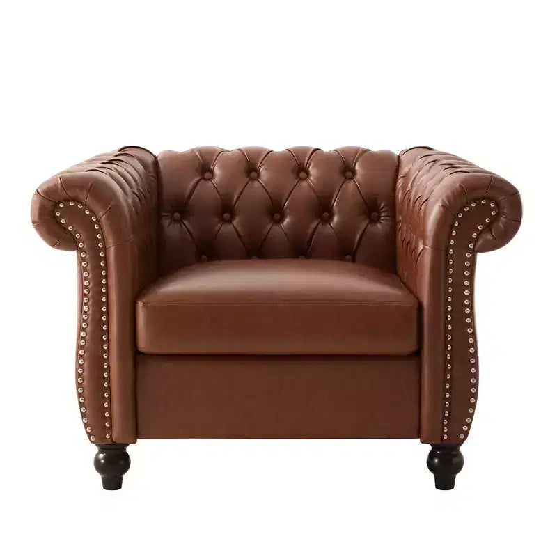 Fauteuil club Chesterfield avec accoudoirs arrondis, garniture cloutée et pieds en bois massif